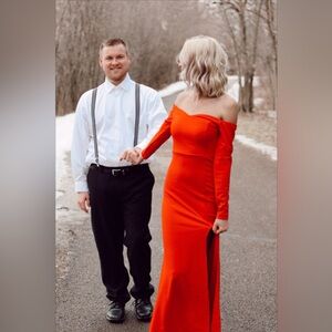 Long sleeved, floor length red dress. Size XS.